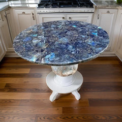 Elegant Round Labradorite Gemstone Table with White Pedestal Base in Modern Kitchen
