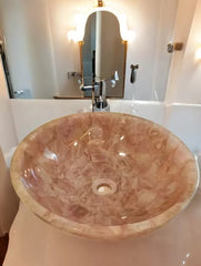 Elegant and Luxurious Pink Quartz Sink with Modern Faucet, Soft Lighting, and a Beautifully Polished Design